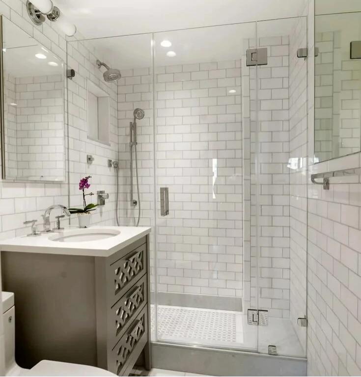 Elegant bathroom featuring a glass shower enclosure and a modern freestanding bathtub