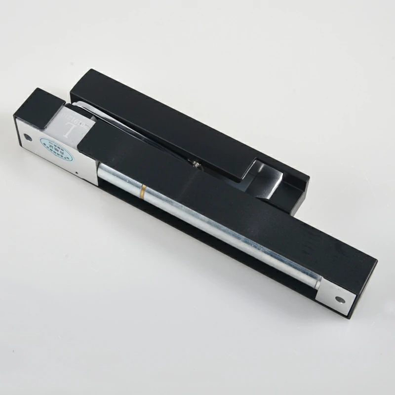 Black door damper with a slim profile designed for discreet installation.