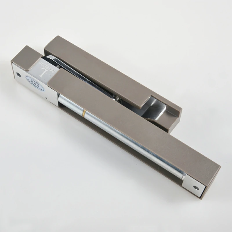 Grey hydraulic door closing damper with adjustable speed for heavy doors.
