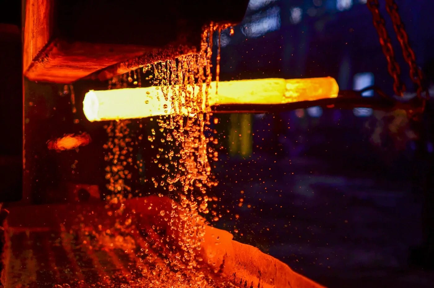 A casting undergoing heat treatment with water cooling, showcasing the casting process in foundries.