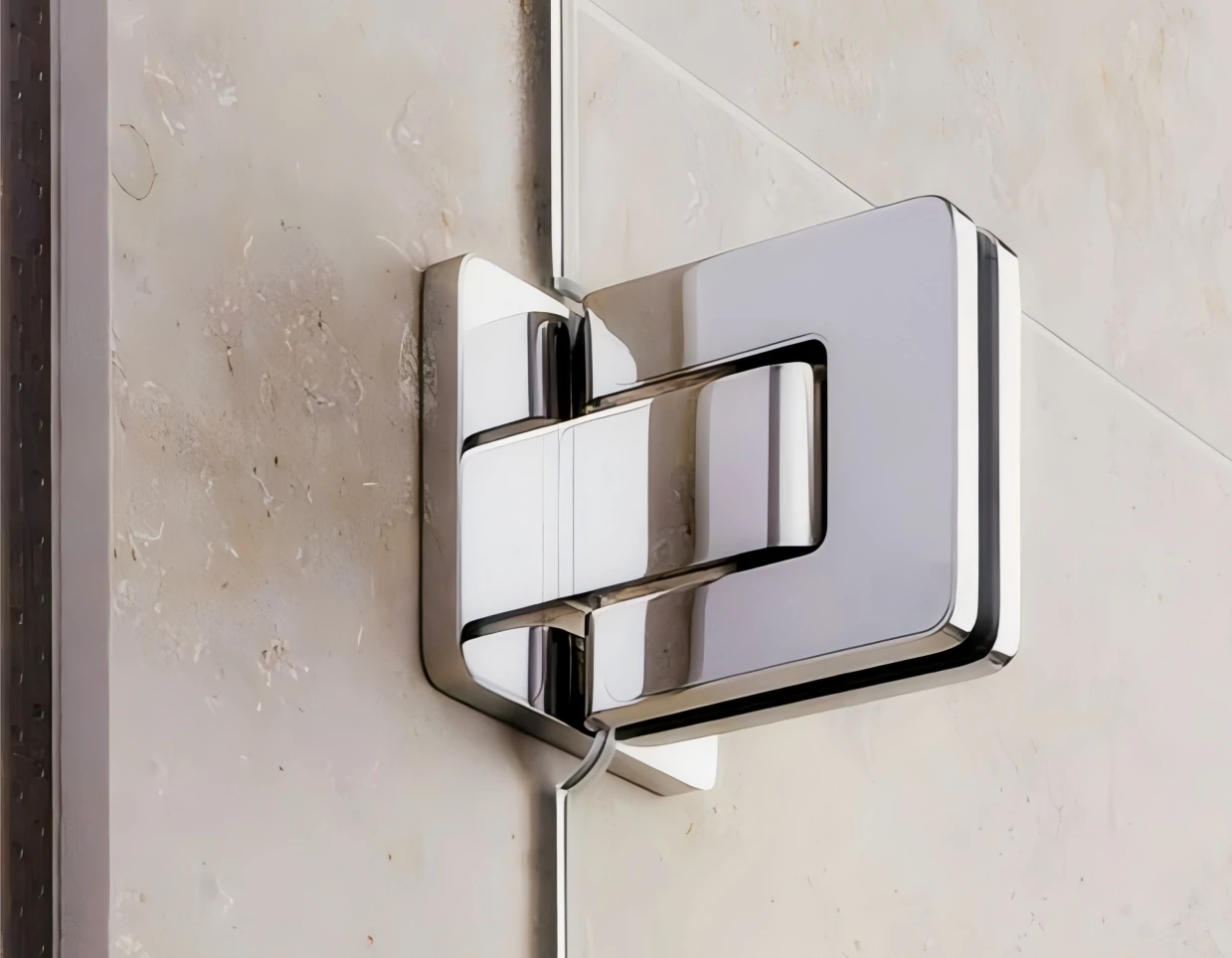 Close-up of 304 stainless steel glass hinge with polished chrome finish, designed for frameless shower doors with corrosion-resistant performance.