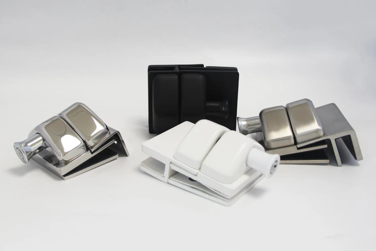 Cast metal magnetic door latches for frameless glass doors in chrome, black, and white finishes.