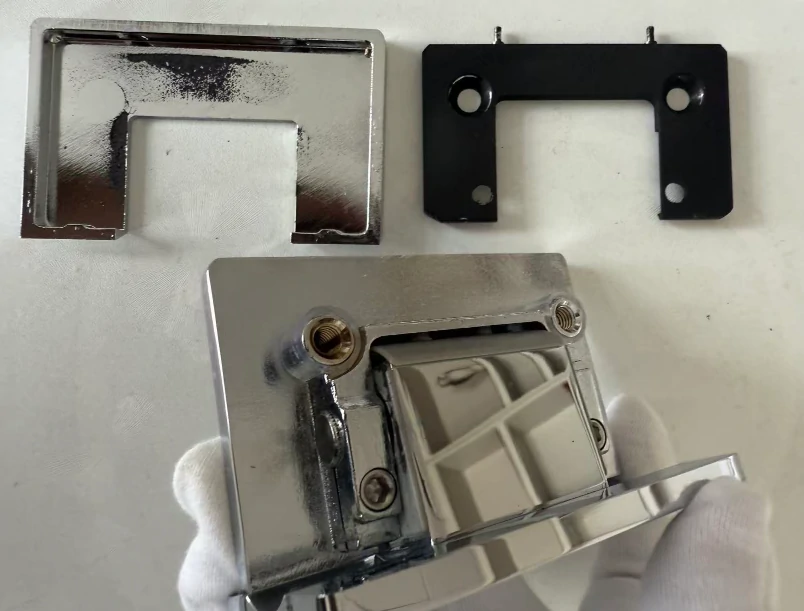 Disassembled view of shower hinge components, revealing the high-quality brass core and gasket system for durability.