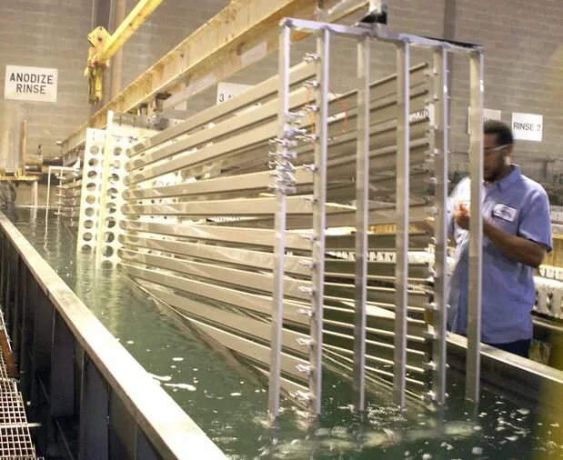 Close-up of an unsealed anodized aluminum surface showing the porous structure that acts as an anchor to improve paint adhesion by over 30%.