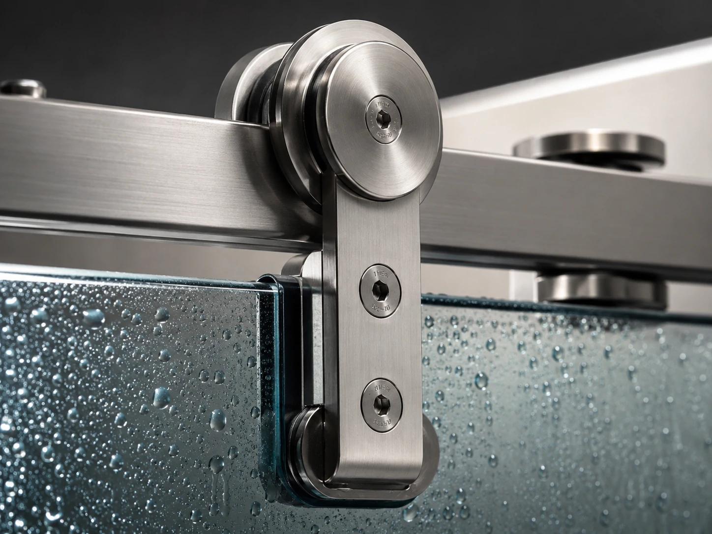 Close-up of a stainless steel roller mechanism on a sliding glass shower door